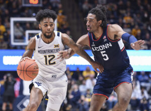 Taz Sherman scores 23, WVU beats No. 15 UConn 56-53